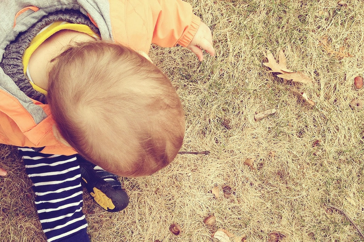 baby looking at the ground