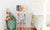 rear view of baby in bed room standing at table