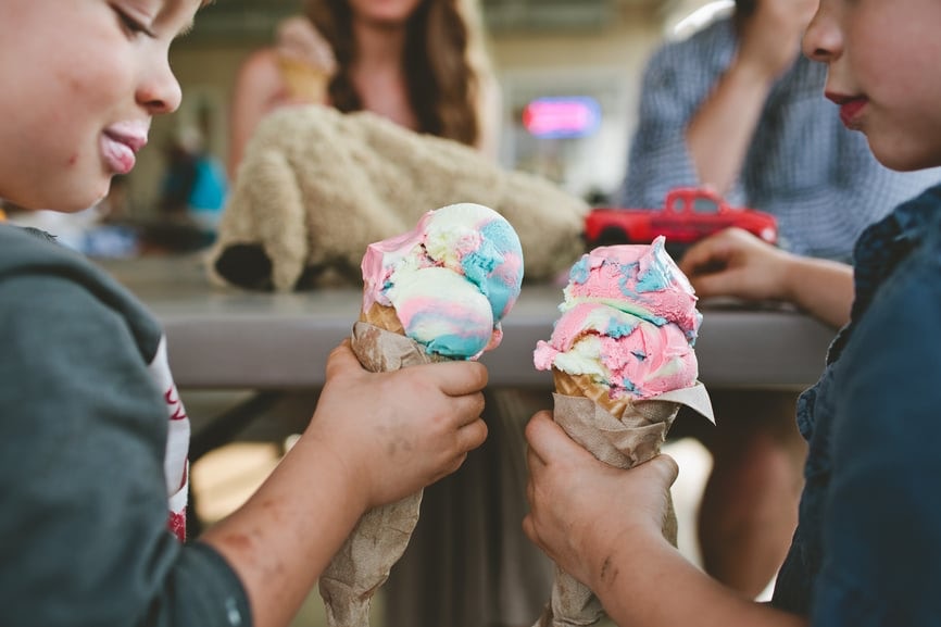 Happy young boys holding  ice cream cone