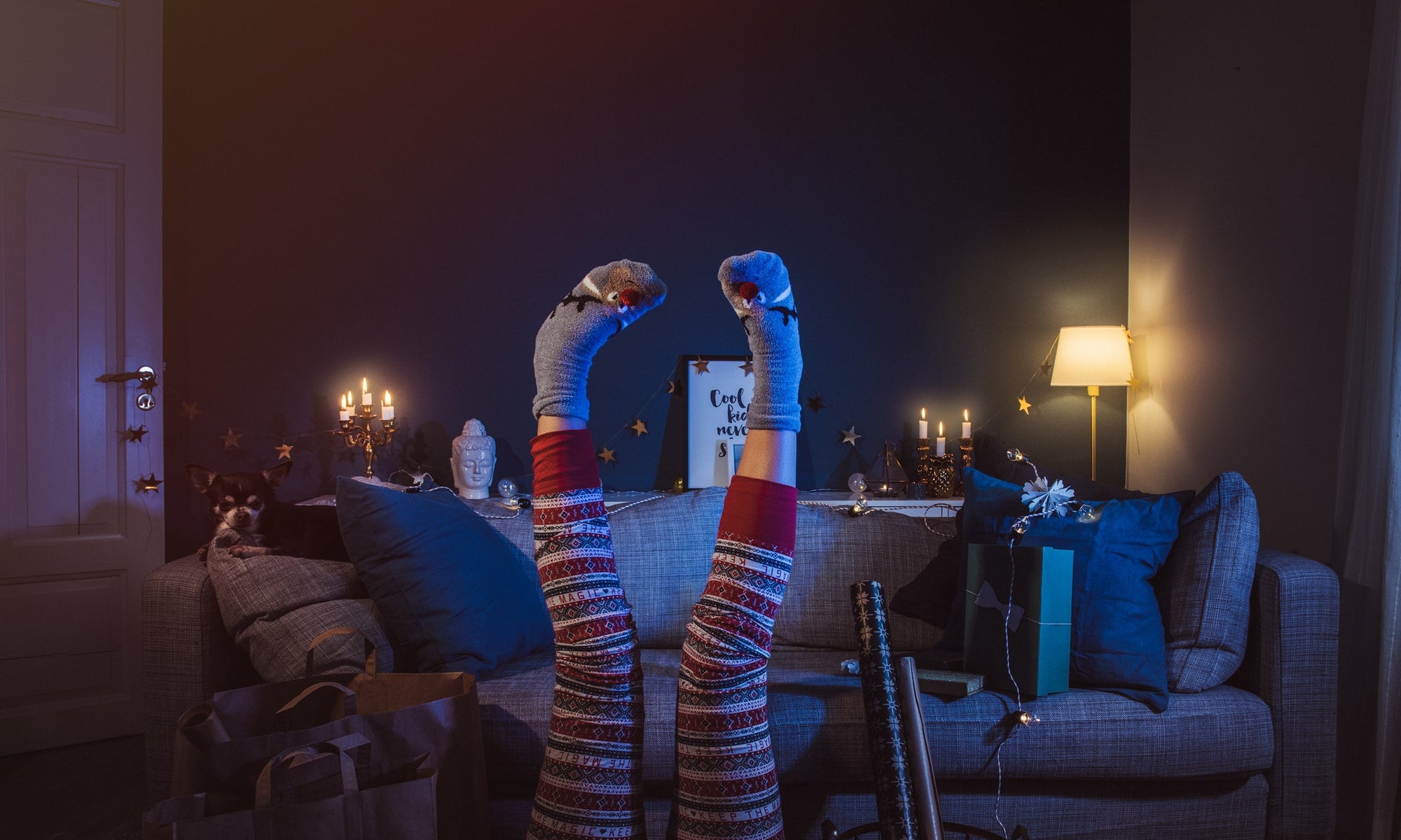 upside down image of women leg's wearing  flowered maroon pants and grey socks