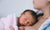 Newborn Baby Sleeping On Mother Chest