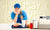 young female employee of a fast food counter standing next to cash counter