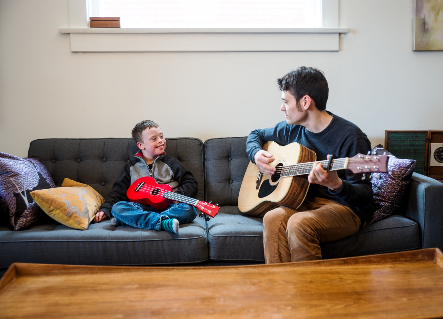 kid playing with guitar