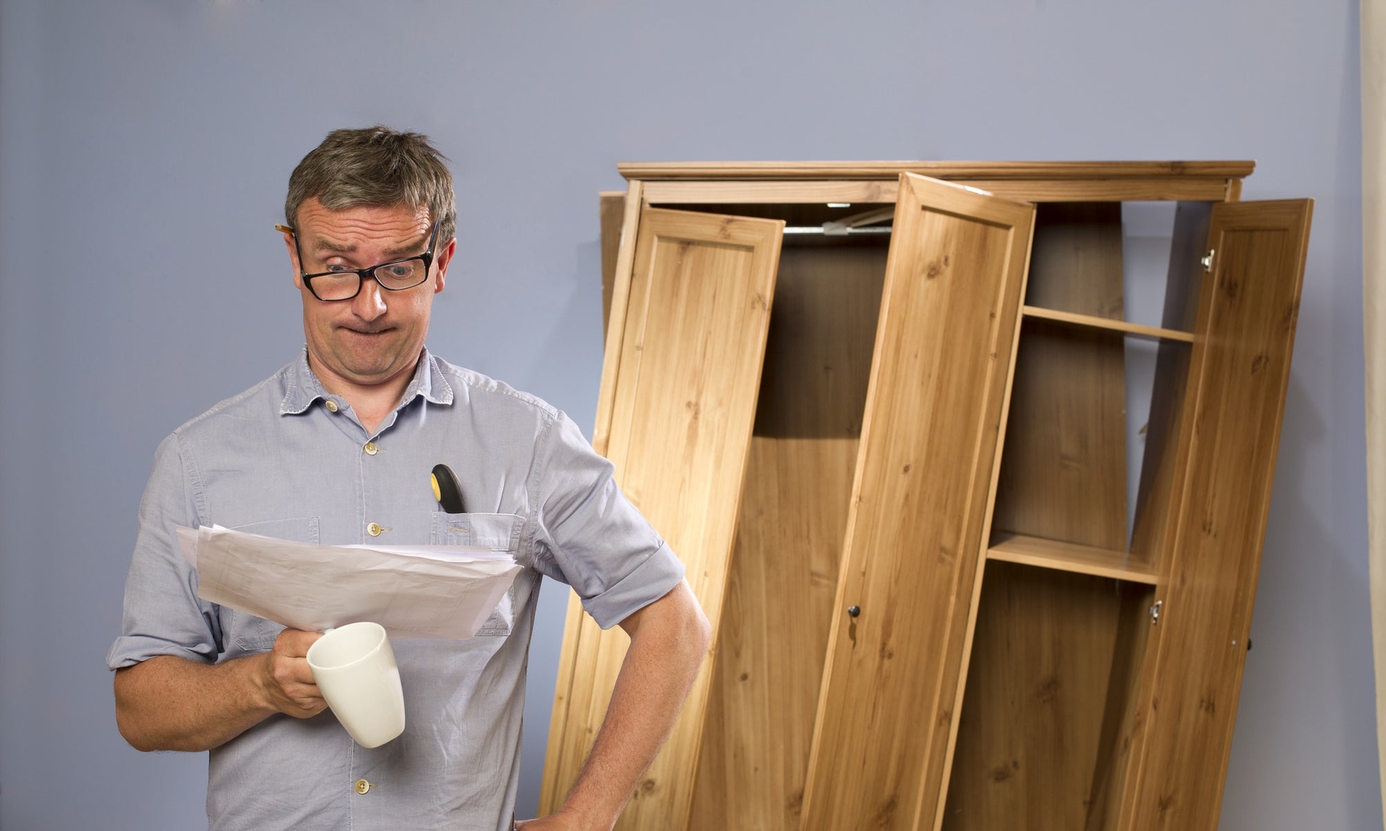 Man Confused Of Assembling Furniture Reading Manual