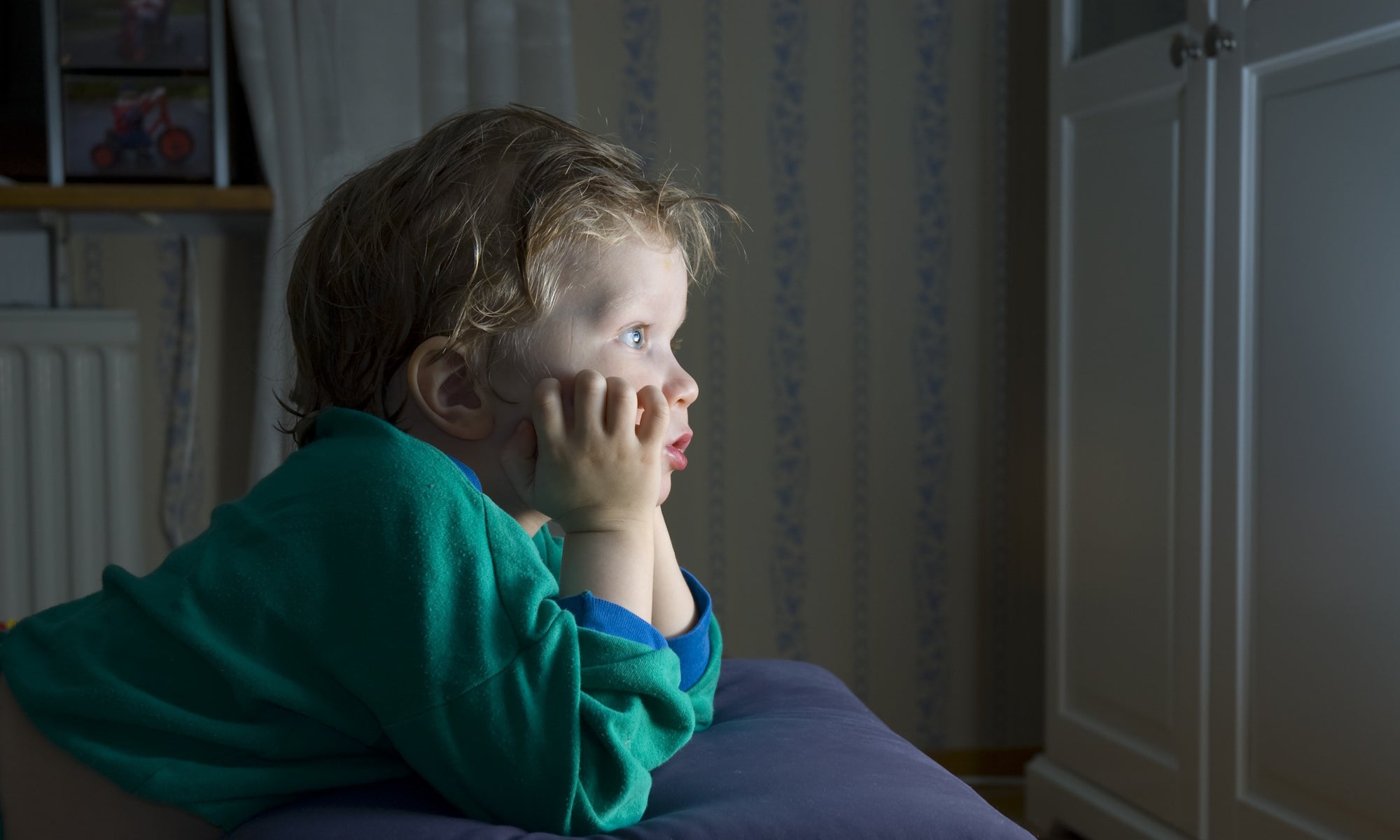 boy watching tv at night