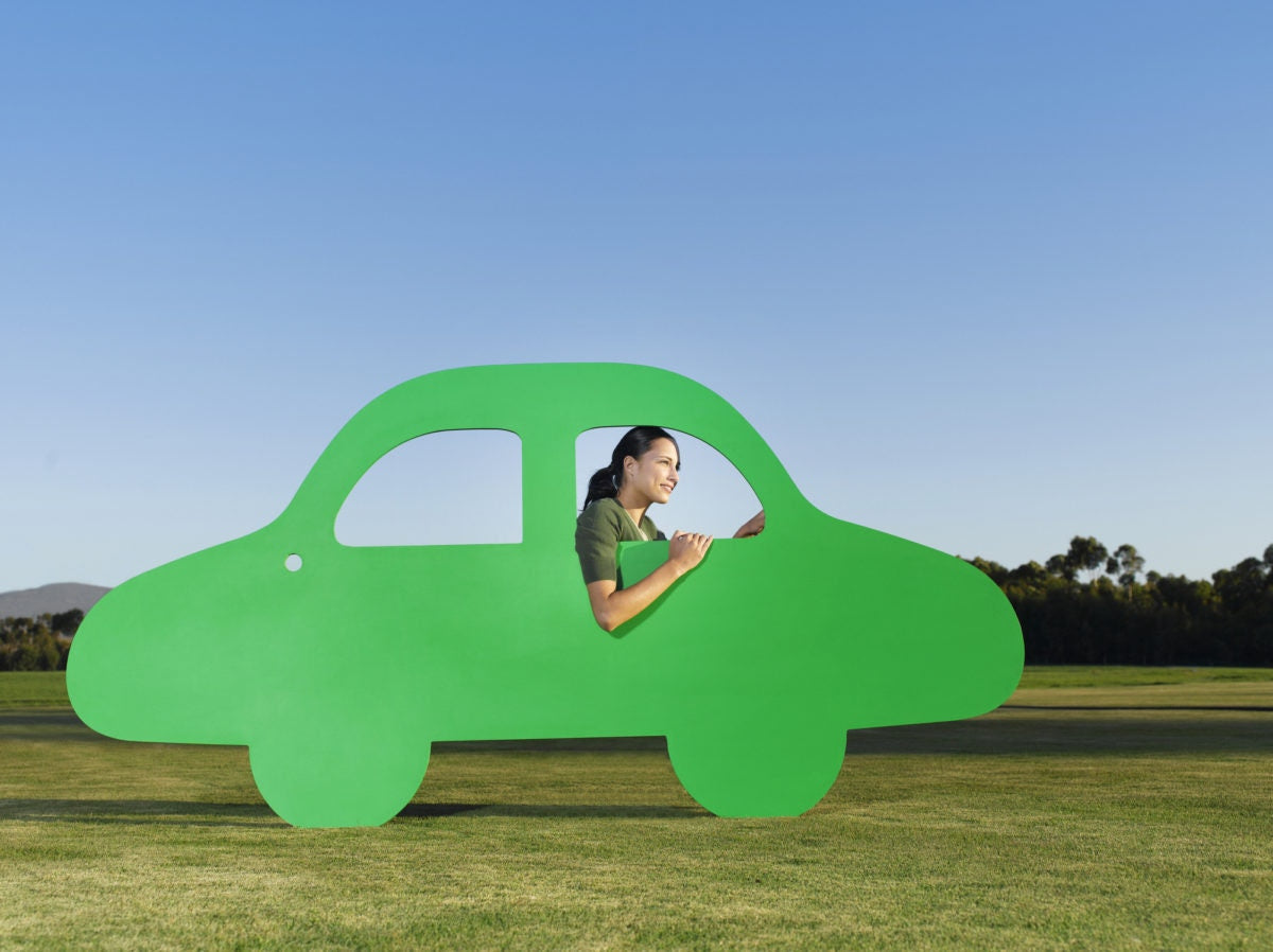 Girl is riding fantacy car in an open field