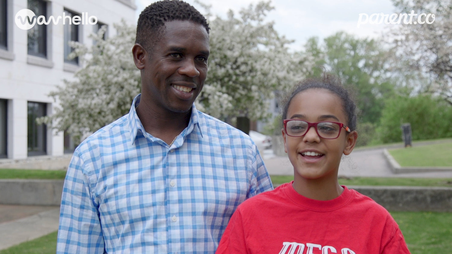 father with his teenage daughter smiling looking at camera