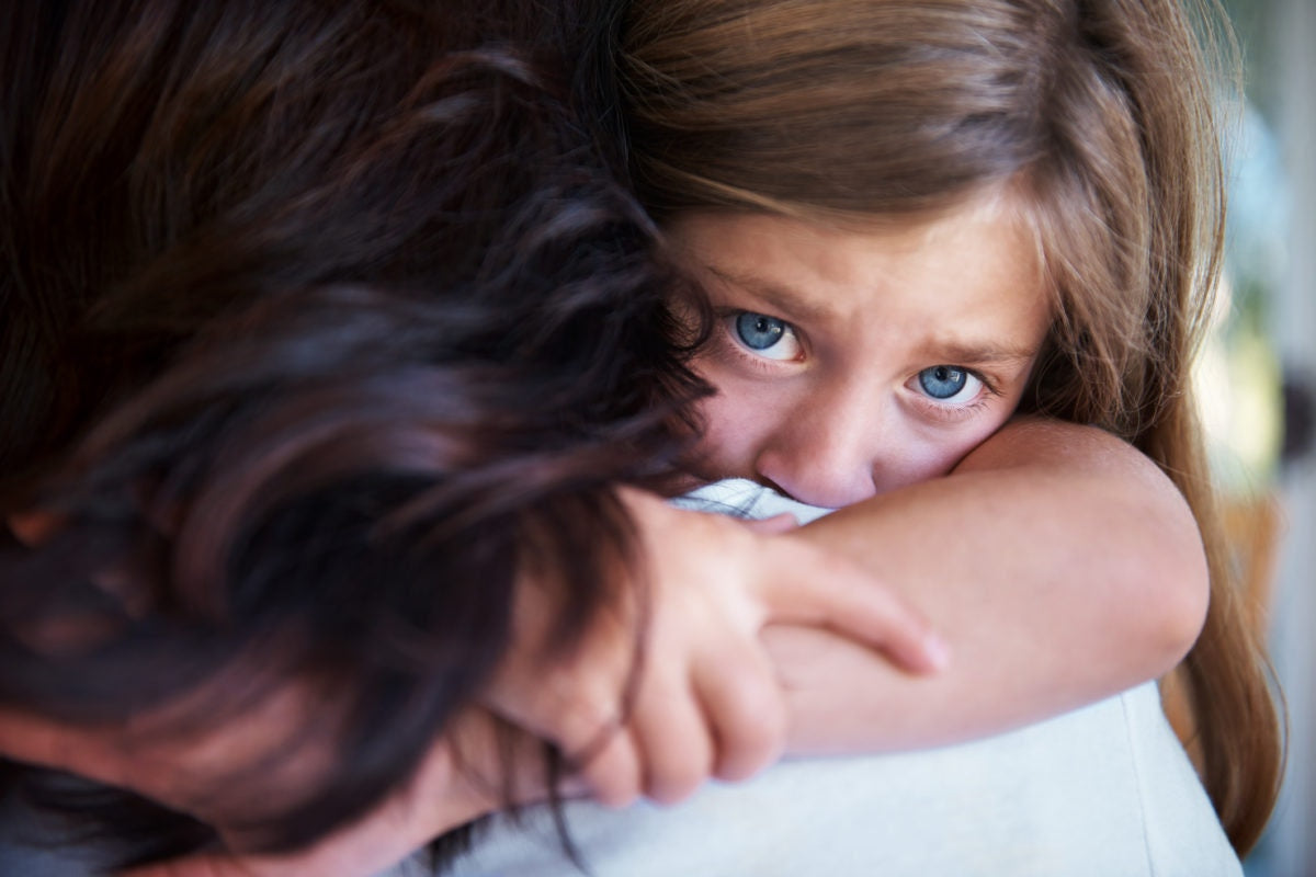 Child scared and hugged mother