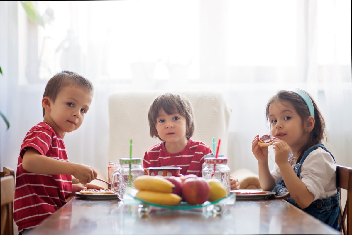 kids having breakfast at dinning table