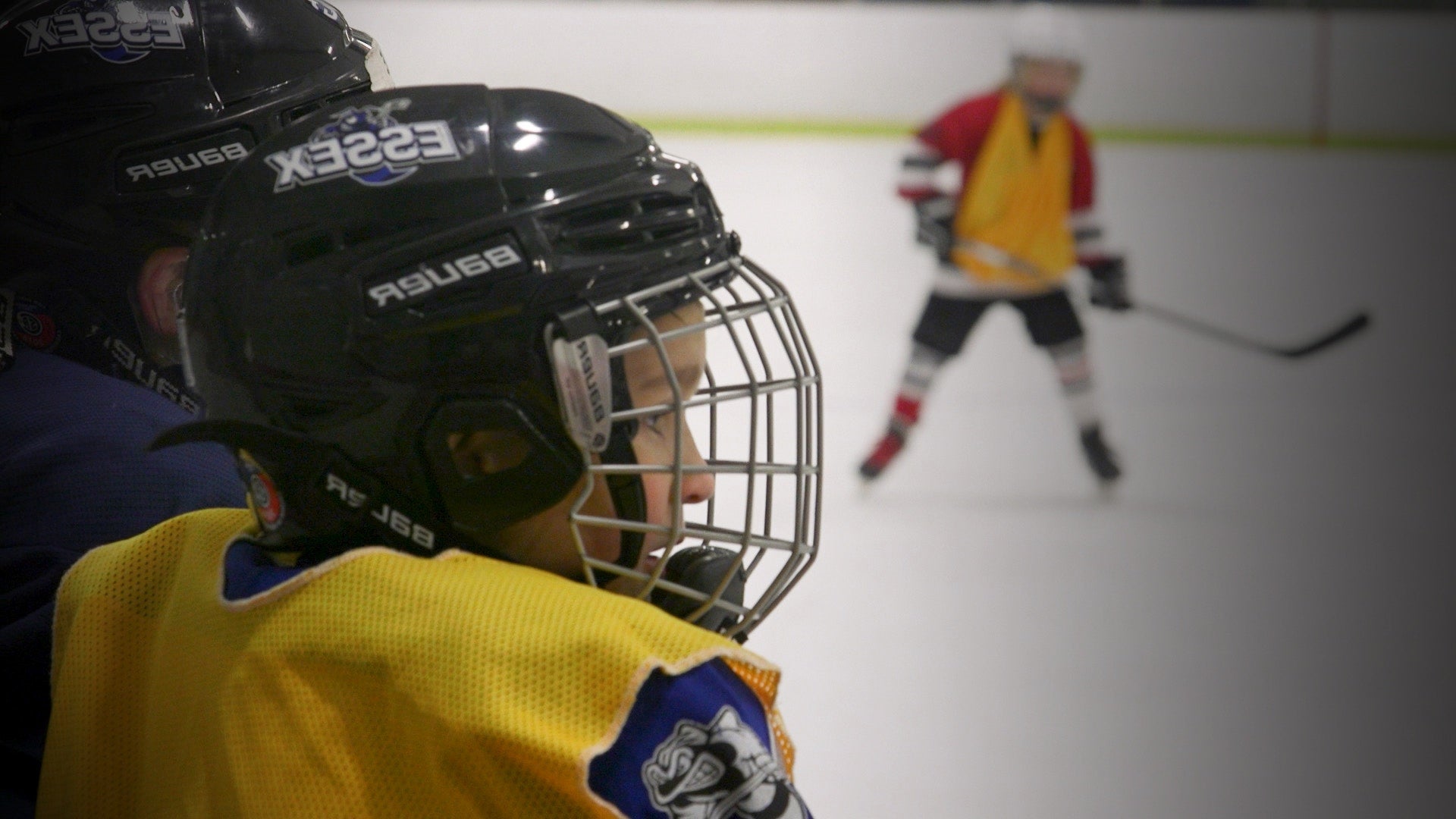 young boy in ice hockey uniform