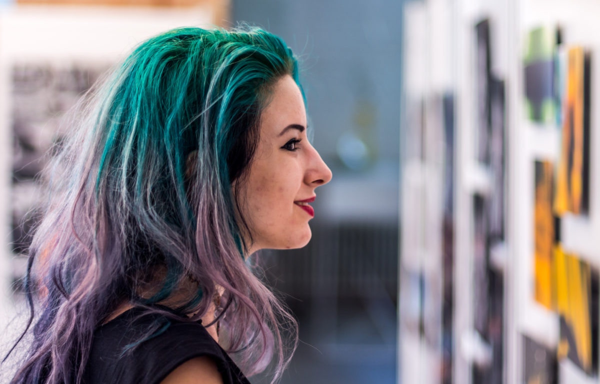 beautiful girl smiling with green dyed hair