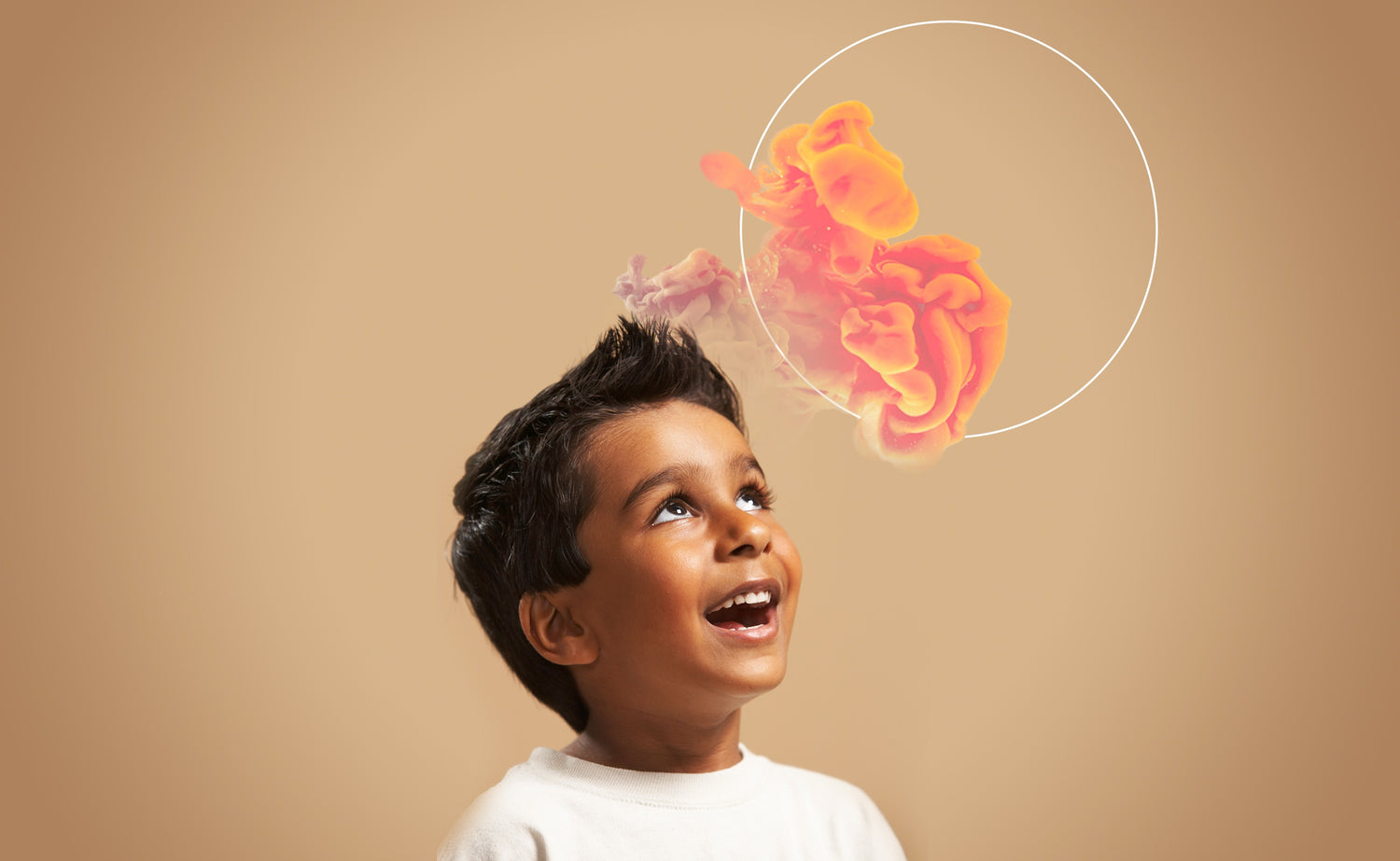 little boy looking upwards and smiling