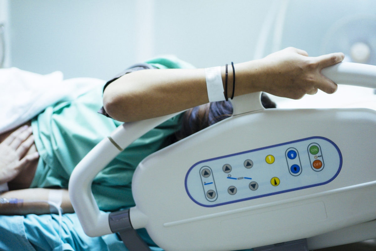 woman in a hospital bed 