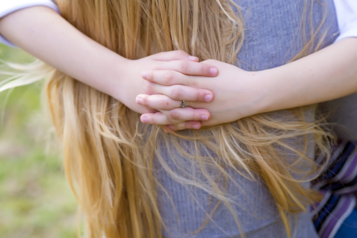 close up of a girl hugging another girl