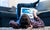 boy on ground looking at a tablet