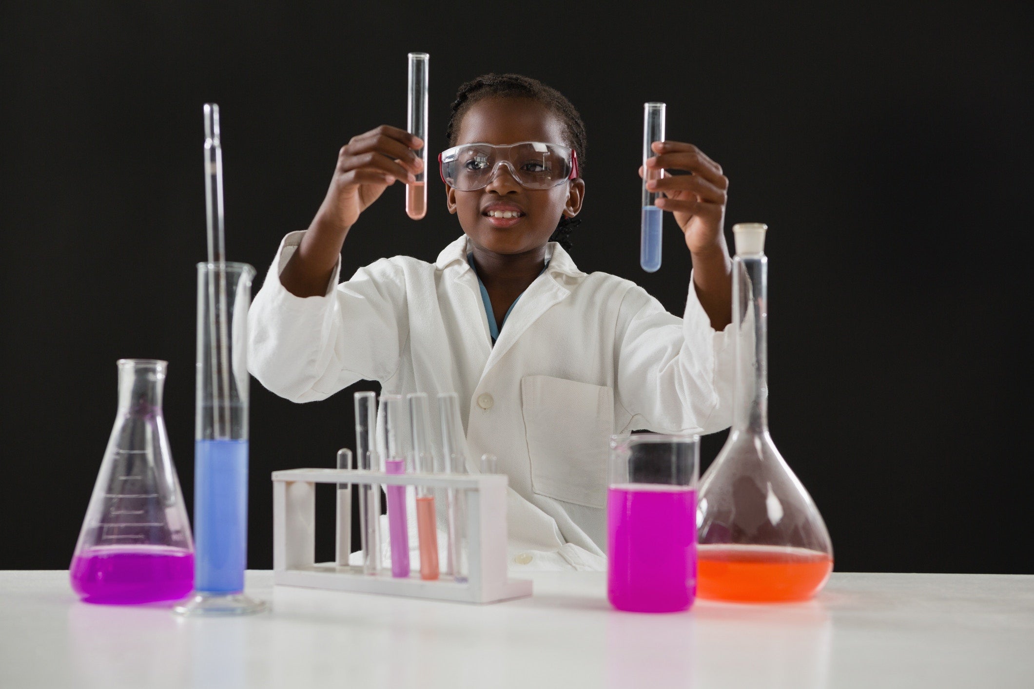 student doing chemistry test with liquids and tubes