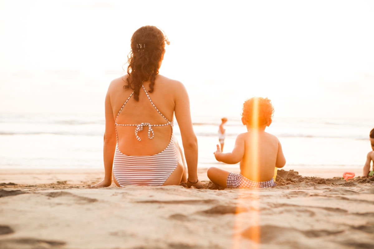 Family sitting on a sea shore