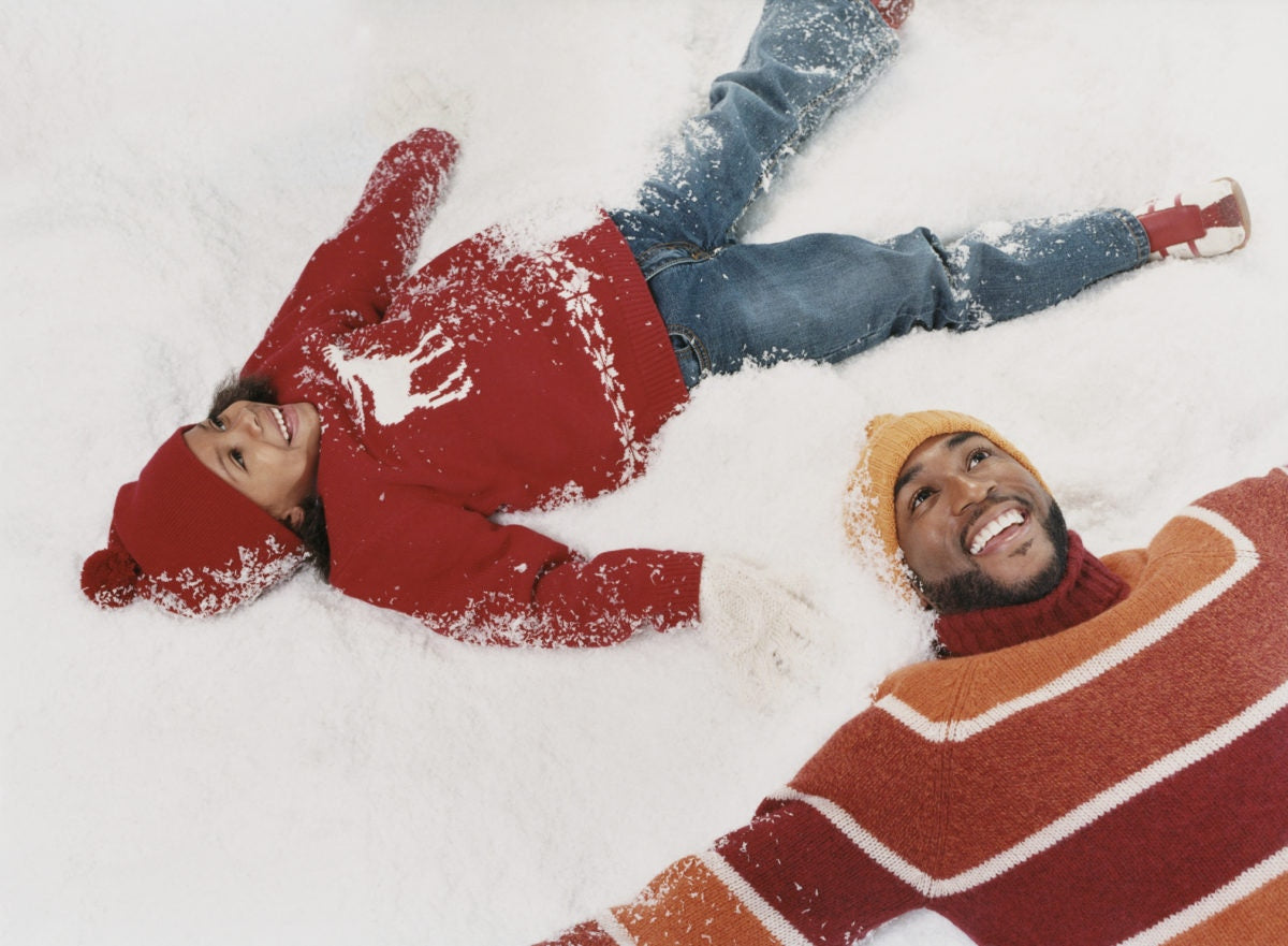 A father and kid is enjoying in snow