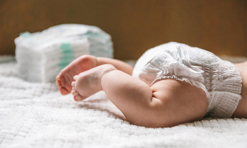 baby in a diaper at the age of two months