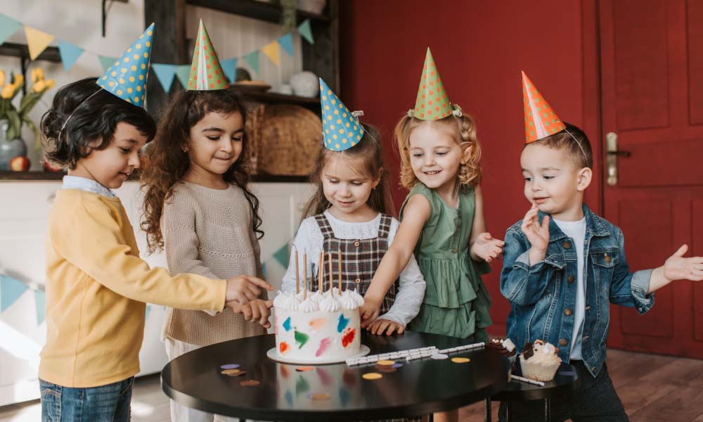 children standing beside black table