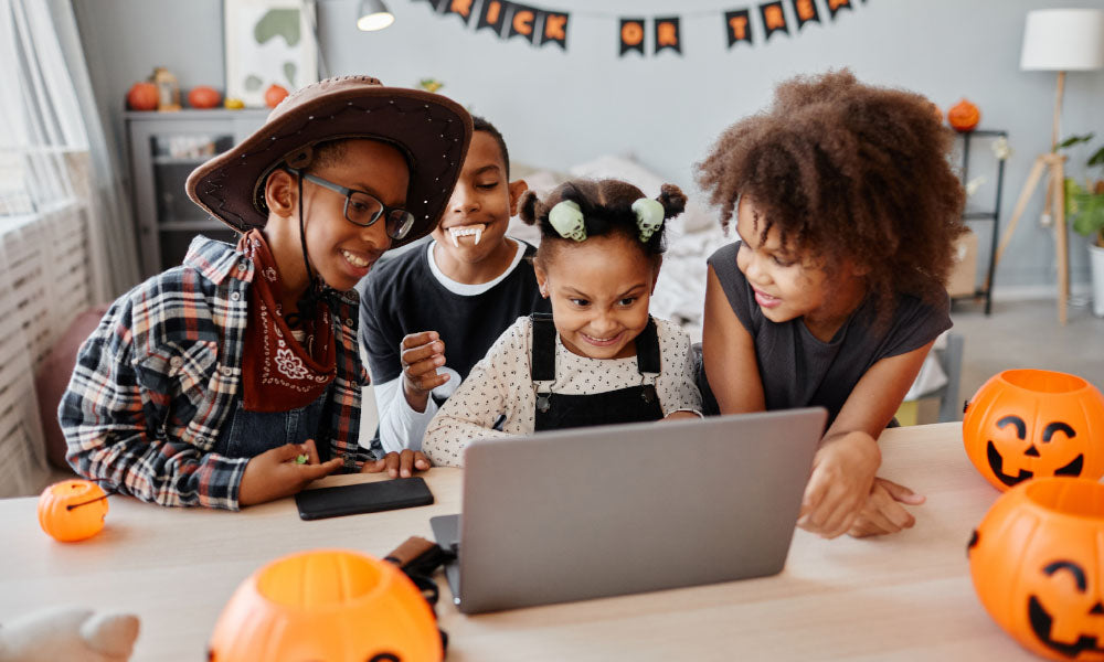 kids using a lap top on halloween