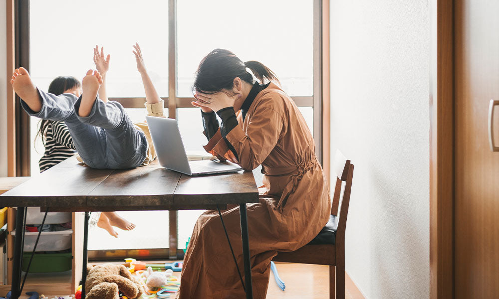 woman looking at computer frustrated